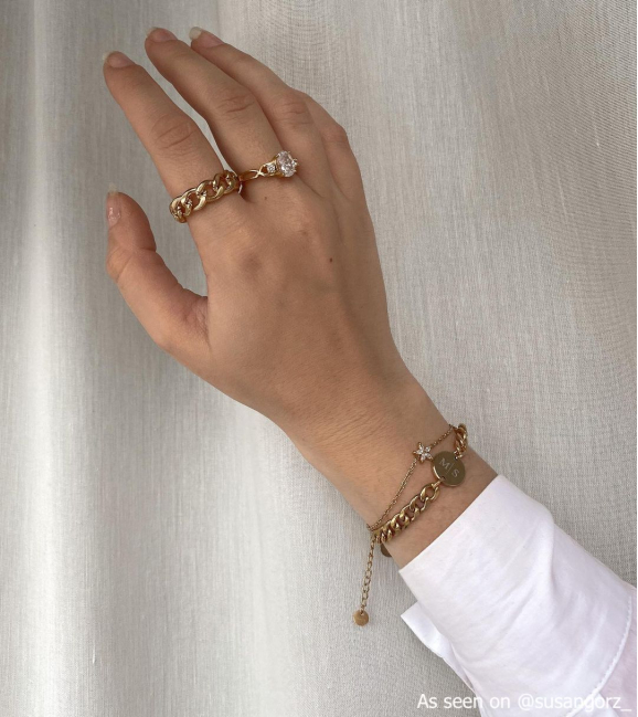 Gouden armparty met ringen en armbande
