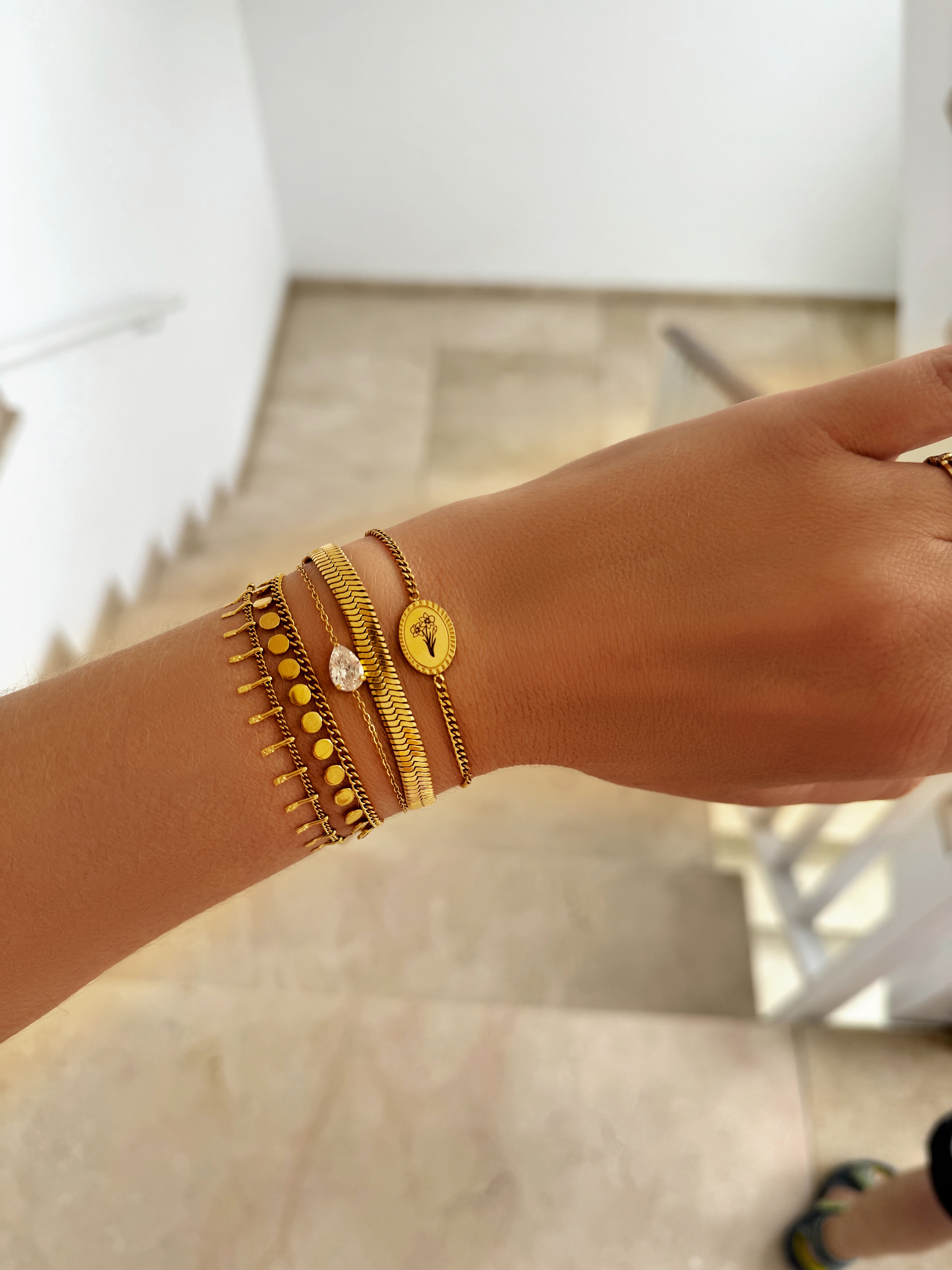 Gouden armparty met coins armband