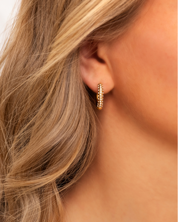 Gouden oorbellen met shiny steentjes