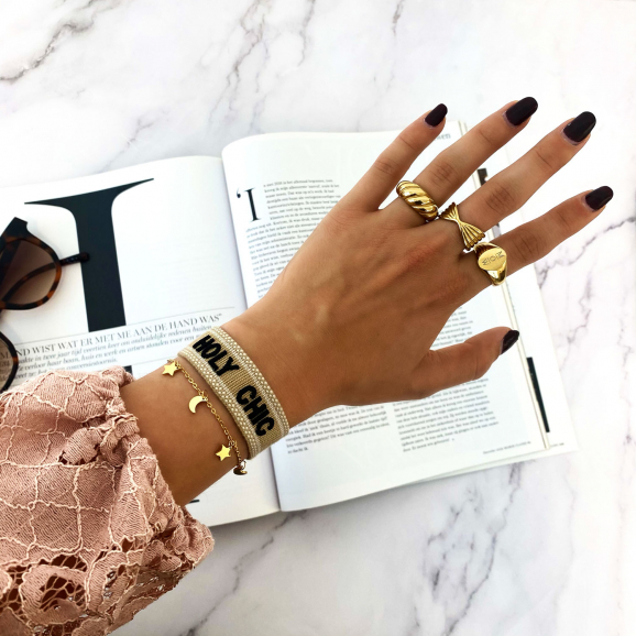 Gouden Holy chic armparty om pols