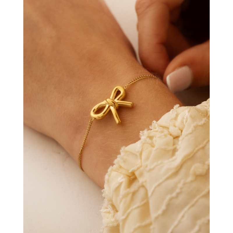 Strikjes armband goudkleurig