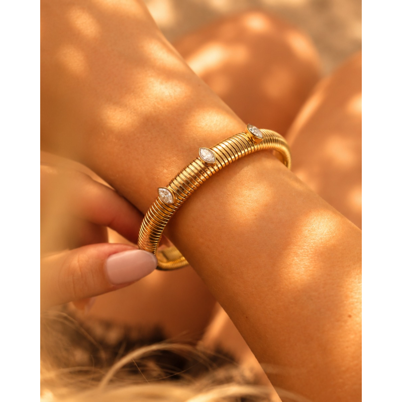 Stretch bangle met steentjes goudkleurig