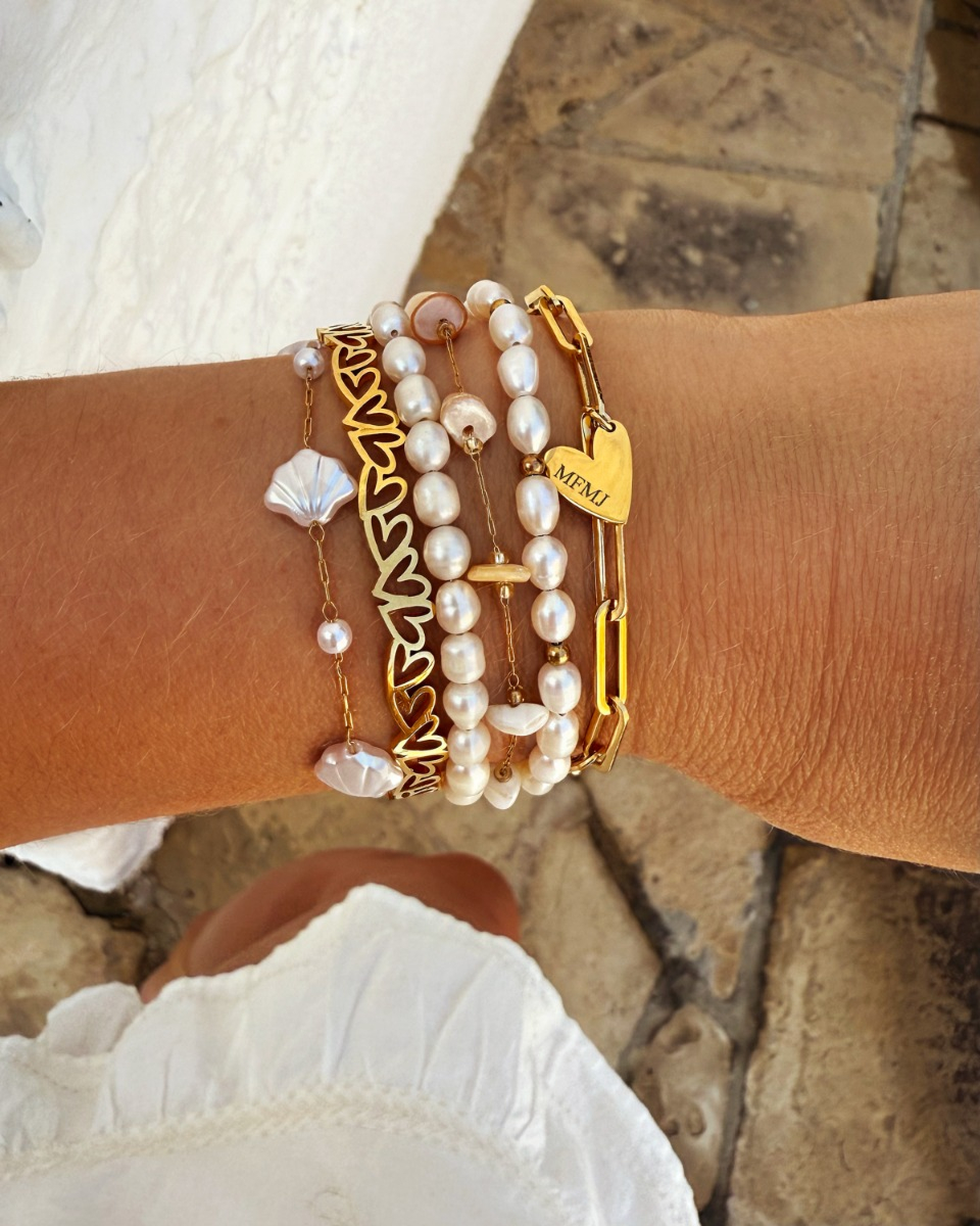 Gouden armparty met parels