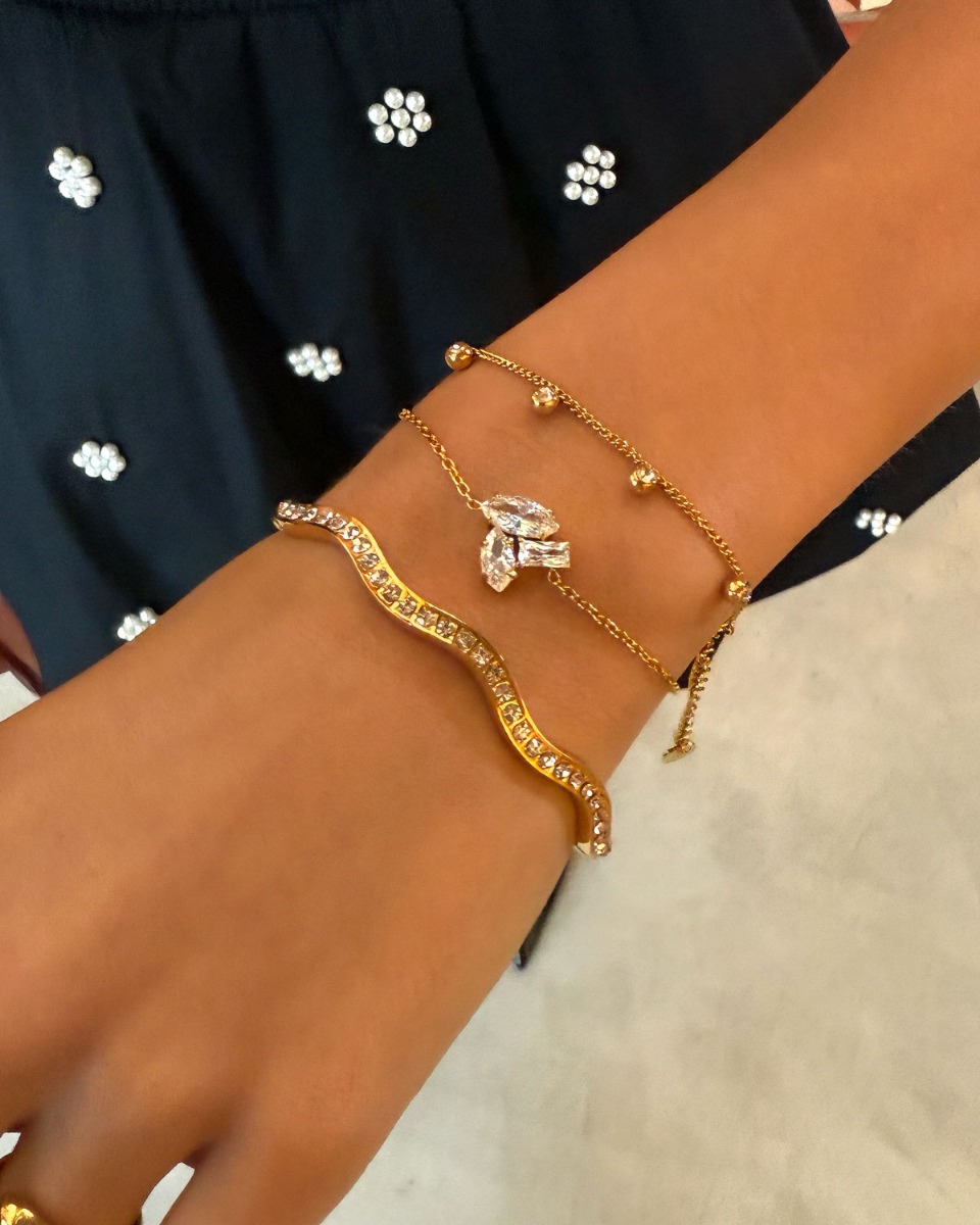 Gouden armparty met steentjes