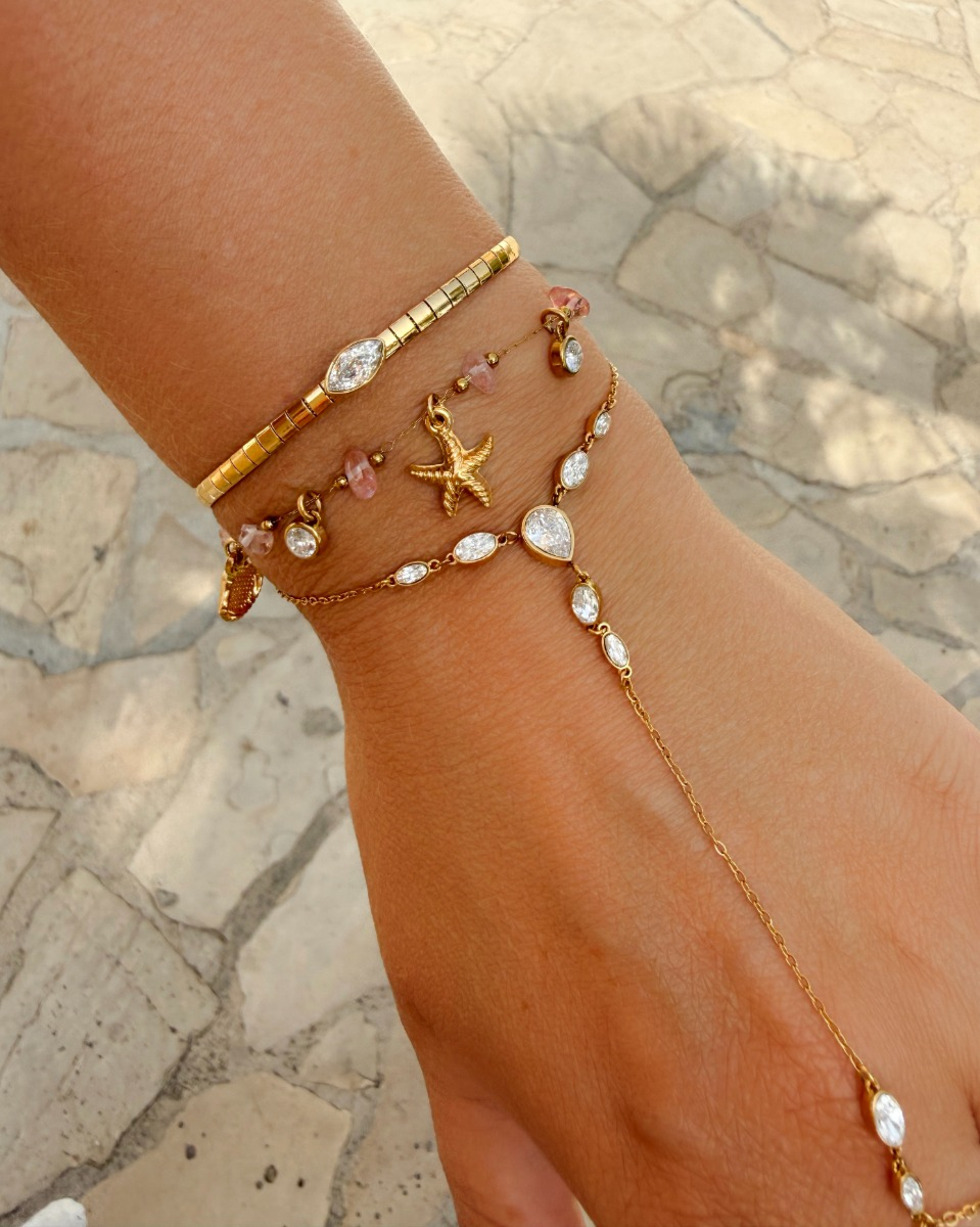 Gouden armparty met steentjes