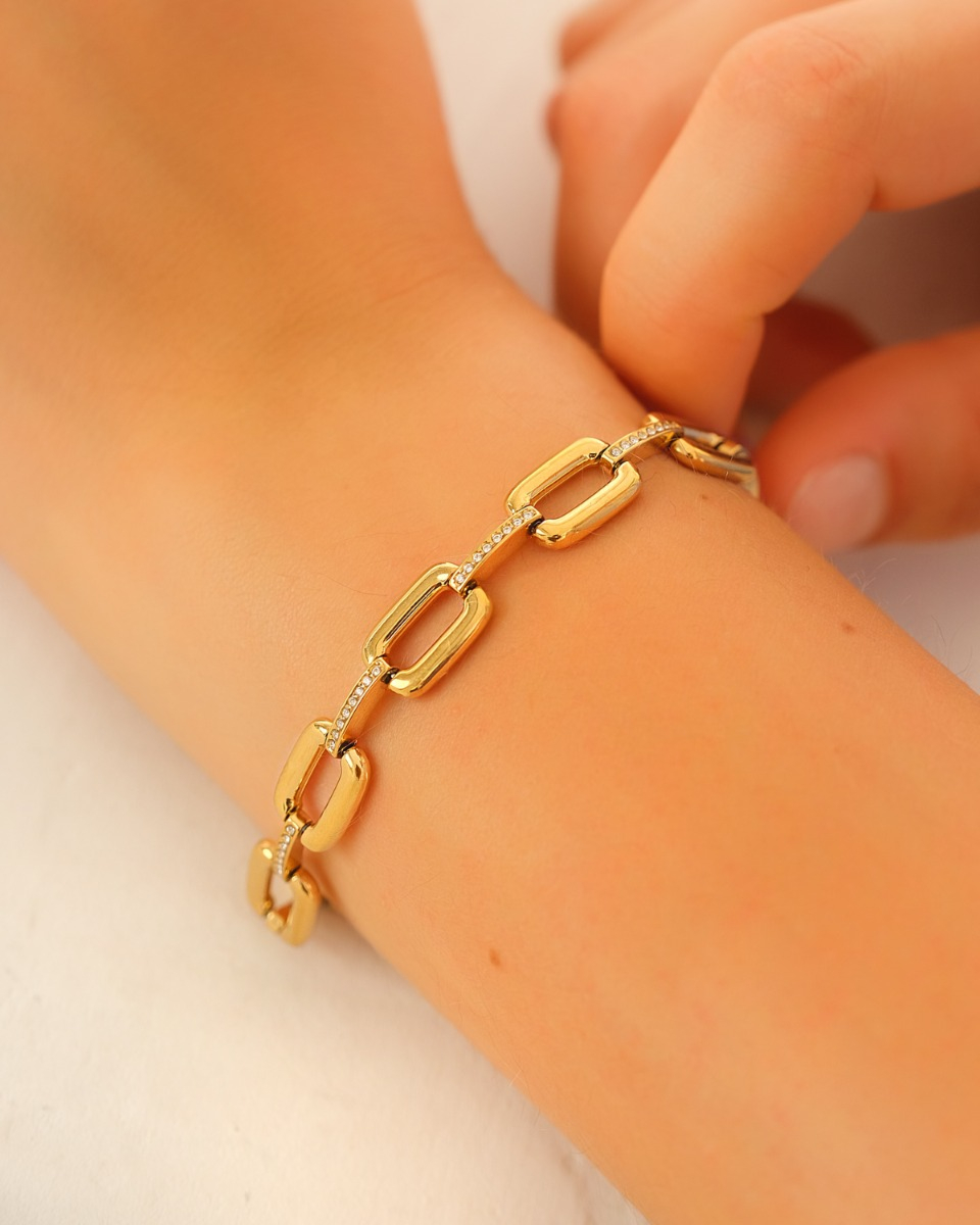 Gouden schakelarmband met steentjes