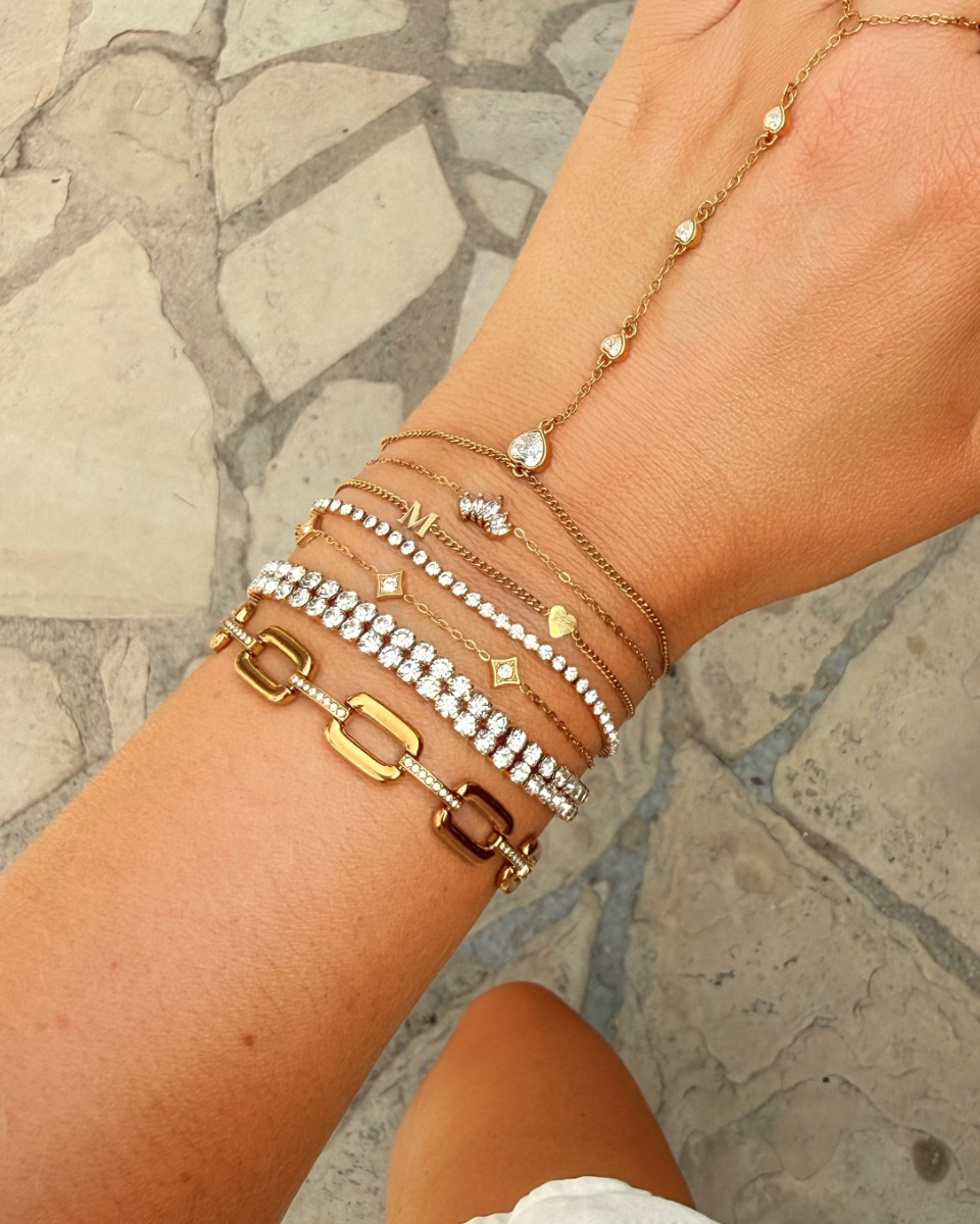 Gouden armparty met steentjes