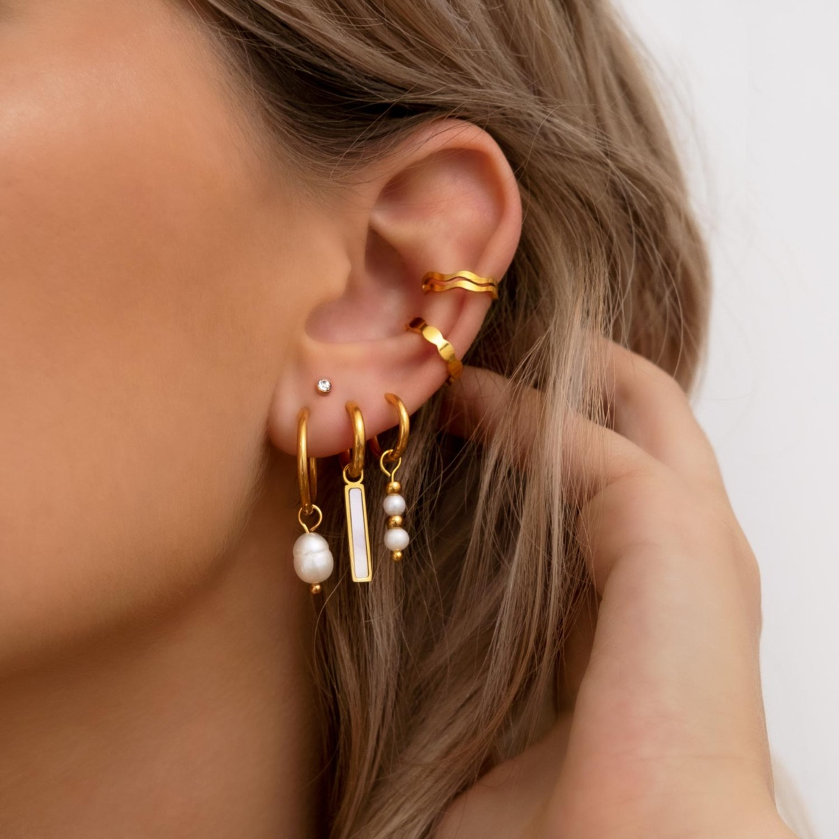 Gouden earparty met parels