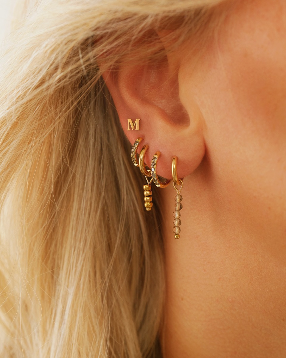 Gouden earparty met bruine steentjes