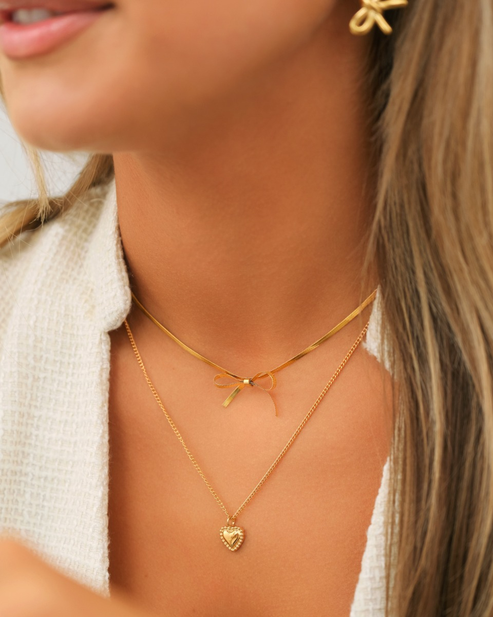 gouden necklace party met strikje en hartje