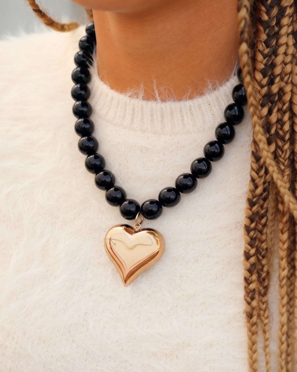 Zwarte kralen ketting met hart goudkleurig