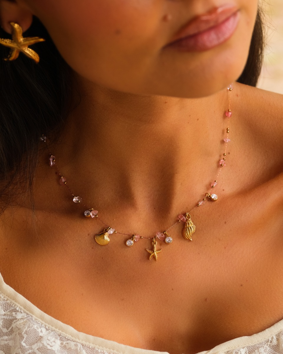 Gouden bedelketting roze steentjes