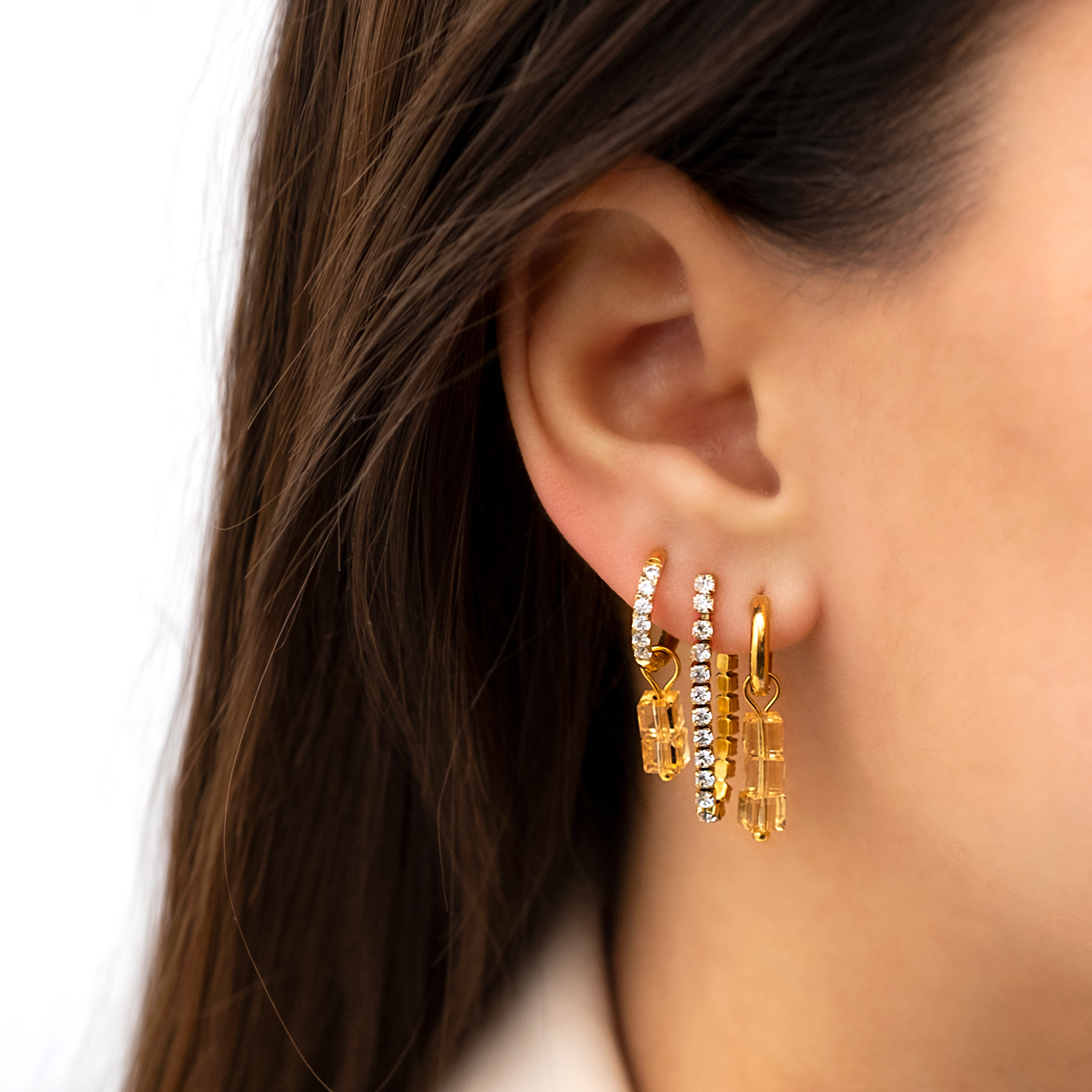 Gouden earparty met tennis oorbellen