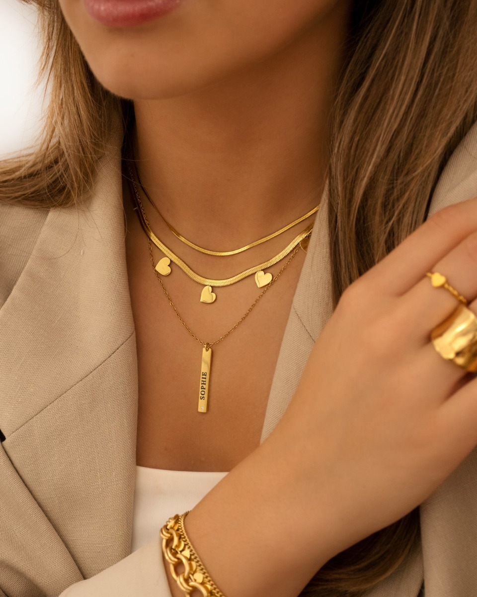 Bar ketting met steentje goud