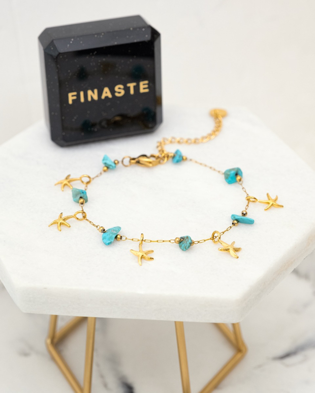 Gouden armband met zeesterren en sieradendoosje