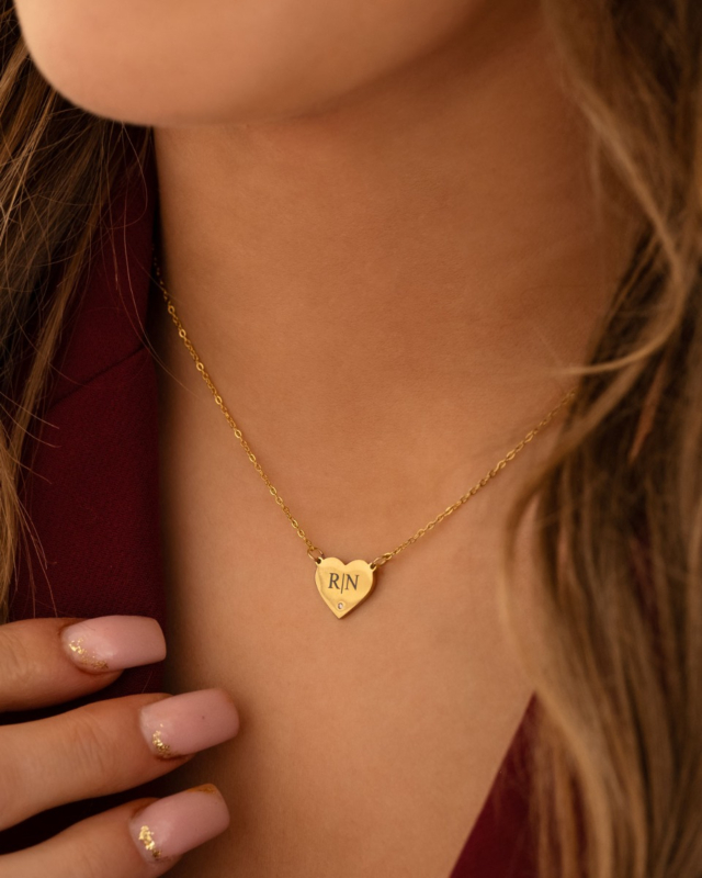 Gouden hartjes ketting met initialen en steentje