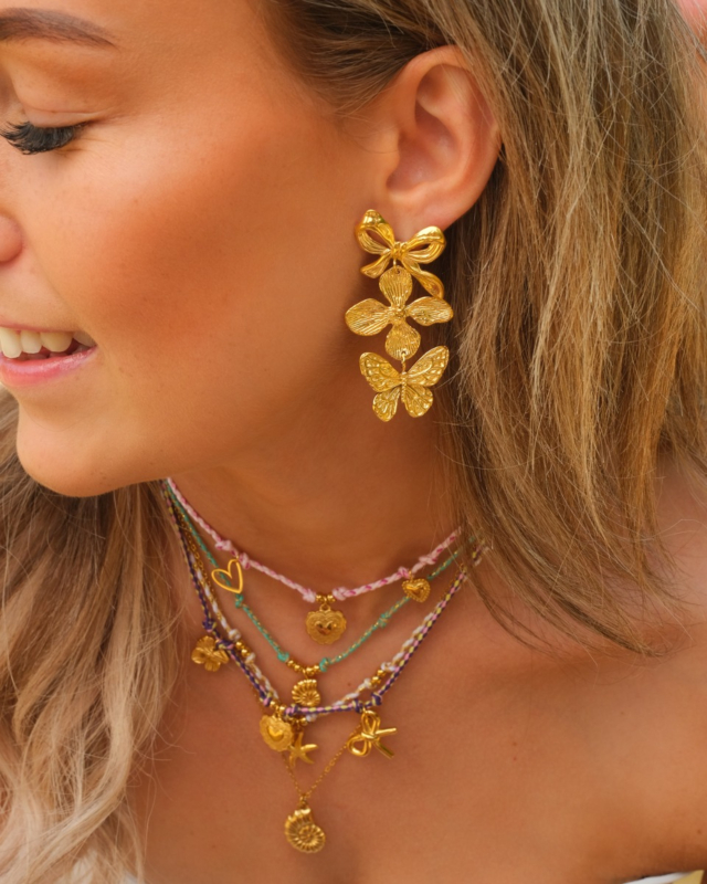 gouden statement oorbellen met touwtjes kettingen