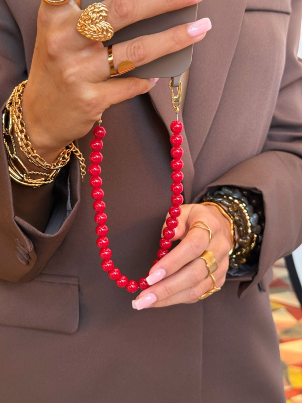 Telefoonkoord met rode kralen