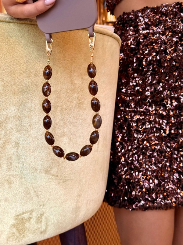 Telefoonkoord met bruine kralen