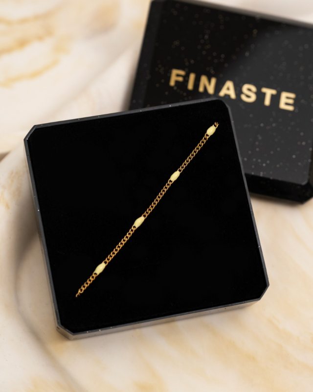 Gouden armband met gele bolletjes