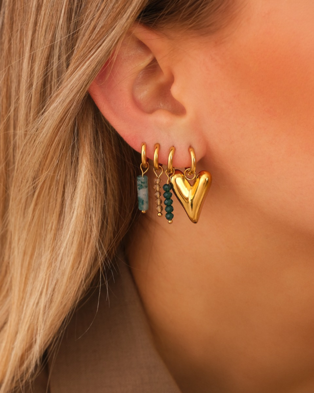 Earparty met groene details goudkleurig