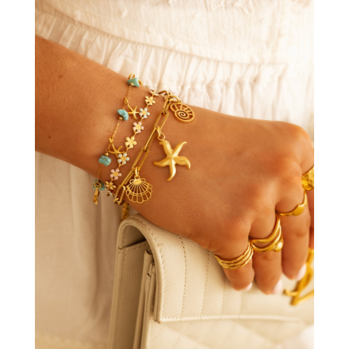 Armband met zeesterren turqouise goudkleurig