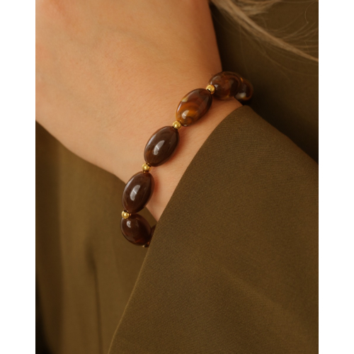 Ovale kralenarmband met bolletjes bruin