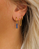 Gouden earparty met blauwe steentjes