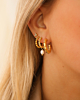 Gouden earparty met gedraaide oorringen