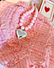 Roze kralen ketting met zilveren hart
