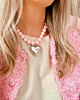 Roze kralen ketting met zilveren hart