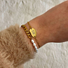 Pols met goud kleurige armcandy
