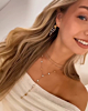 Y ketting met ronde steentjes goudkleurig
