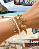 Gouden armparty met kleurtjes