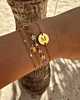 Gouden armparty met roze kleurtjes