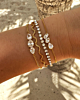 Gouden armparty met steentjes