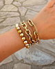 Gouden armparty met chunky chains