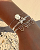 Zilveren armparty met strikjes