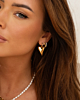 Gouden earparty met hartjes en steentjes