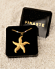 Gouden zeester ketting met pastel in sieradendoosje