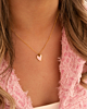 Gouden hartjes ketting met roze hartje
