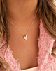 Zilveren hartjes ketting met roze hartje