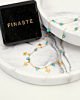 gouden ketting met zeesterren en turquoise steentjes met sieradendoosje