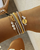 Gouden armparty met steentjes