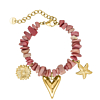 Bedelarmband met roze steentjes goudkleurig