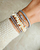 Zilveren bangle armparty met kralen en steentjes