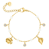 Bedelarmband witte steentjes en zee bedels goudkleurig