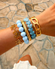 Blauwe kralen armparty goud