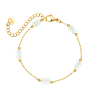 gouden armband met witte kraaltjes