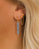 Gouden earparty met blauwe kralen